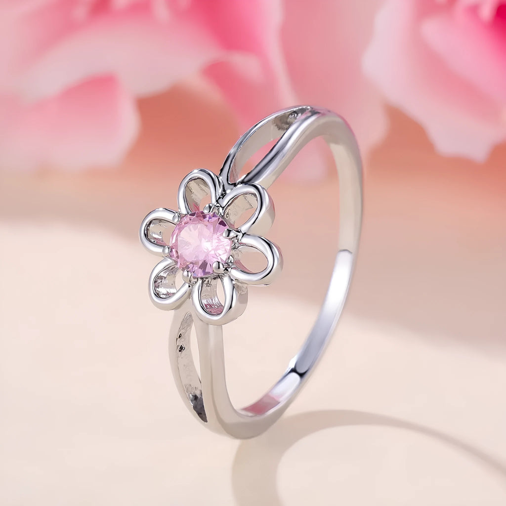 Women's hollow floral ring made from copper with electroplated finish in platinum pink diamond colour