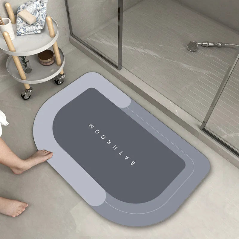 Cushioned blue oval bathroom floor mat on tiled flooring