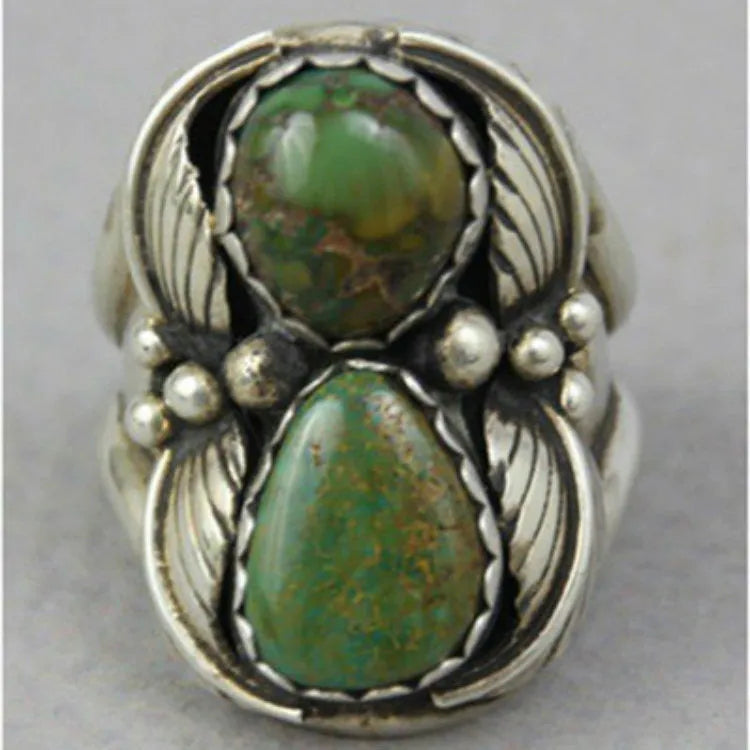 Turquoise geometric women's alloy ring with electroplated finish and retro styling on finger.