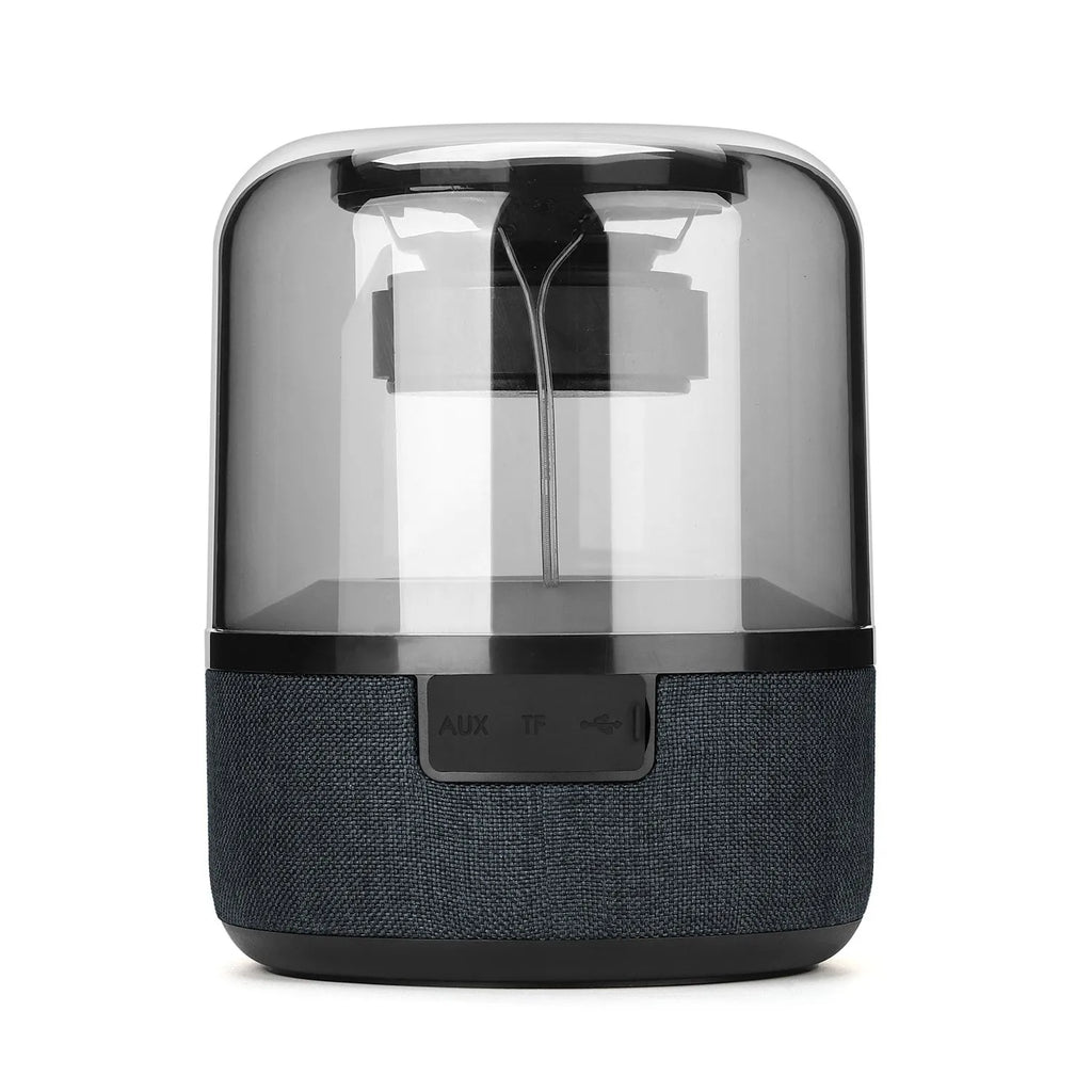 Black wireless Bluetooth speaker with touch controls, showcasing its compact design and 360-degree sound output.