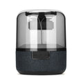 Black wireless Bluetooth speaker with touch controls, showcasing its compact design and 360-degree sound output.