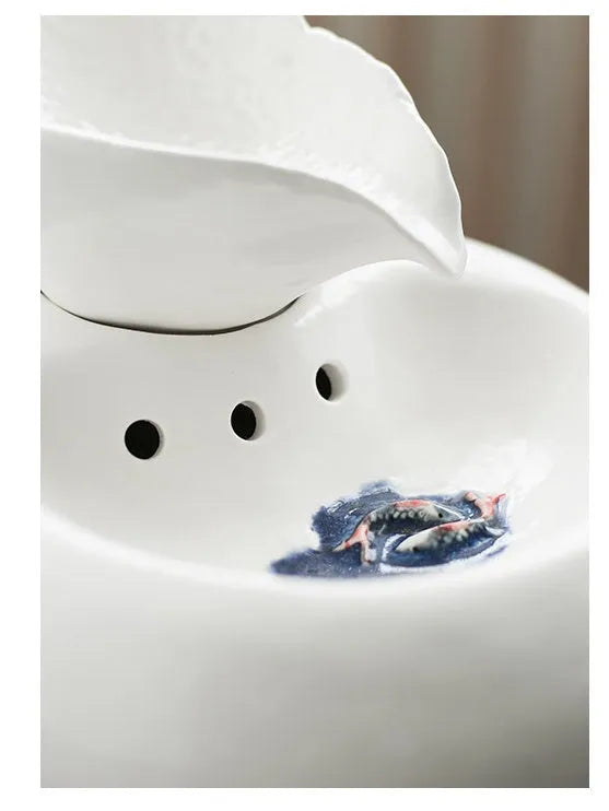 White ceramic automatic cat water dispenser with leaf-shaped bowl and pump