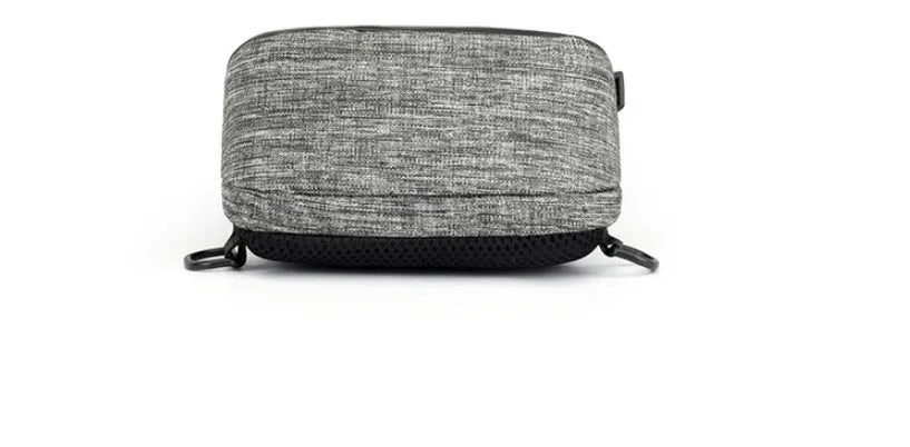 Small square dark blue Oxford cloth chest bag with a single strap and zipper, shown worn across the chest.
