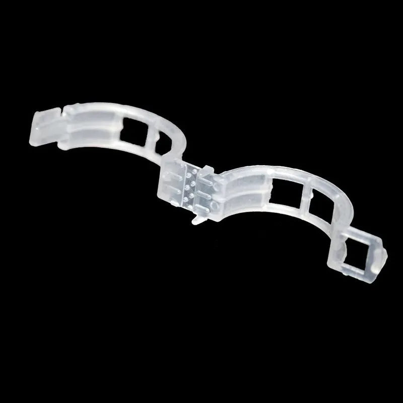 Set of 50 green and blue plastic grafting clips for supporting tomato plants and tree branches.