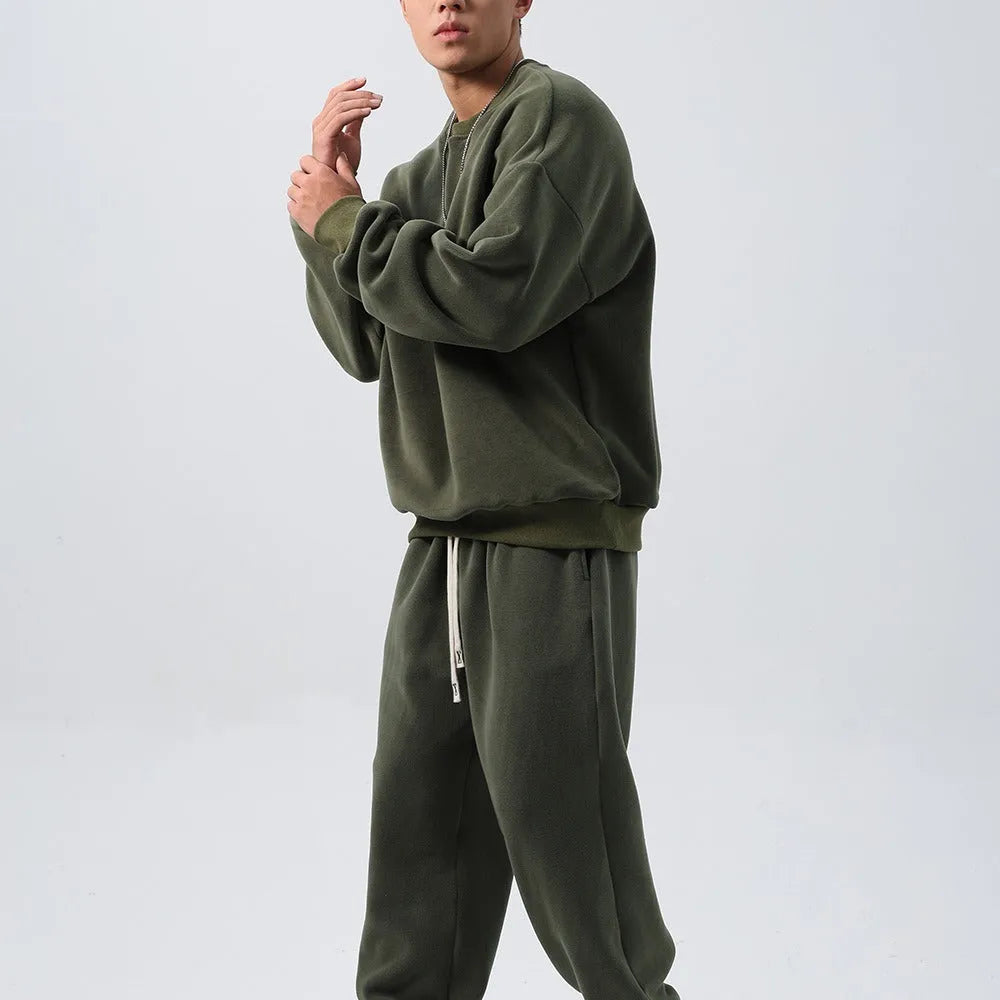 Men's black polar fleece tracksuit with crew neck jacket and matching padded trousers