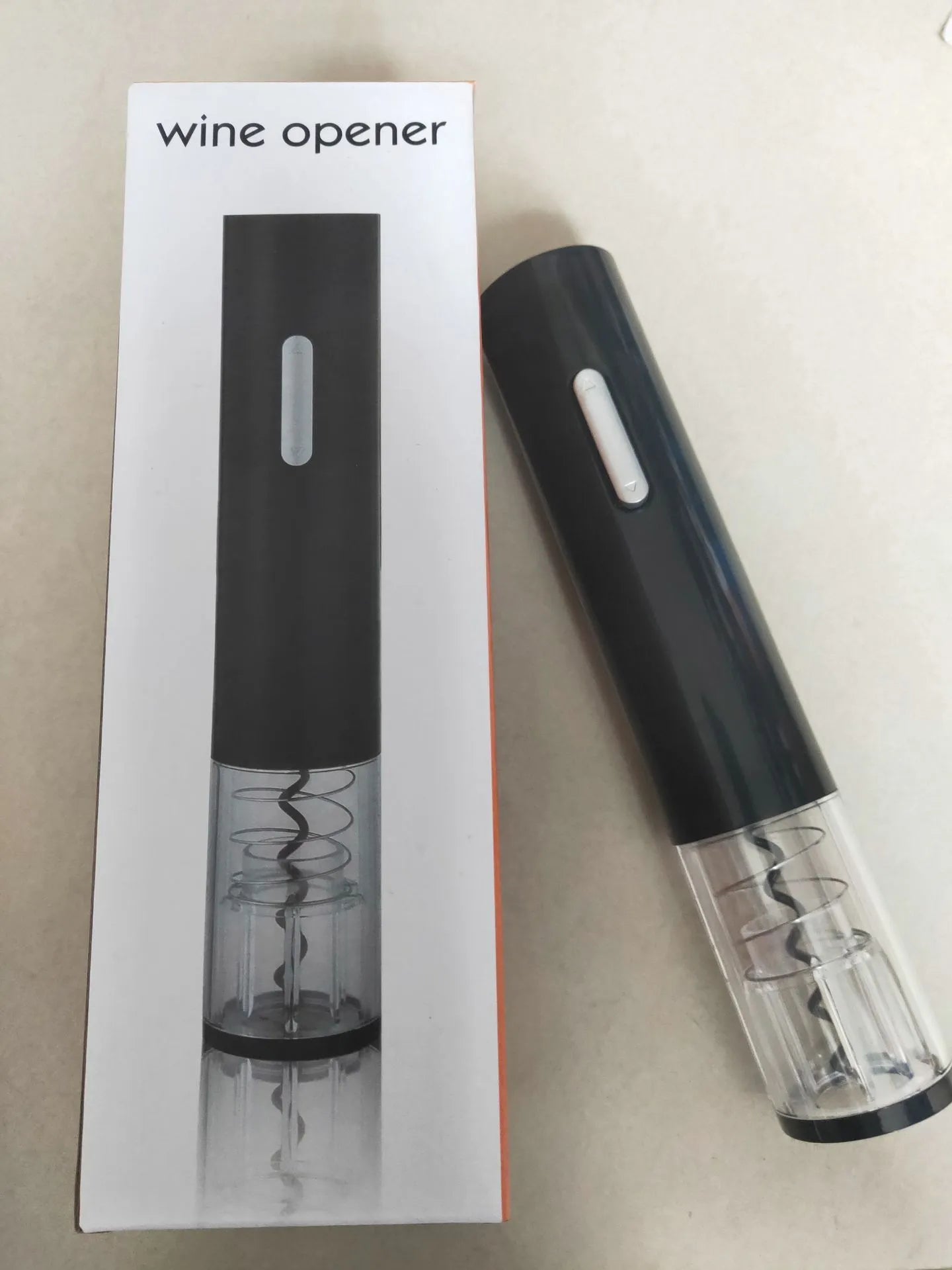 Electric wine opener with foil cutter in red, black and white colour options showing compact design