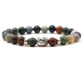 Tigereye Buddha head stretch bracelet with round natural stone beads on a black elastic band.