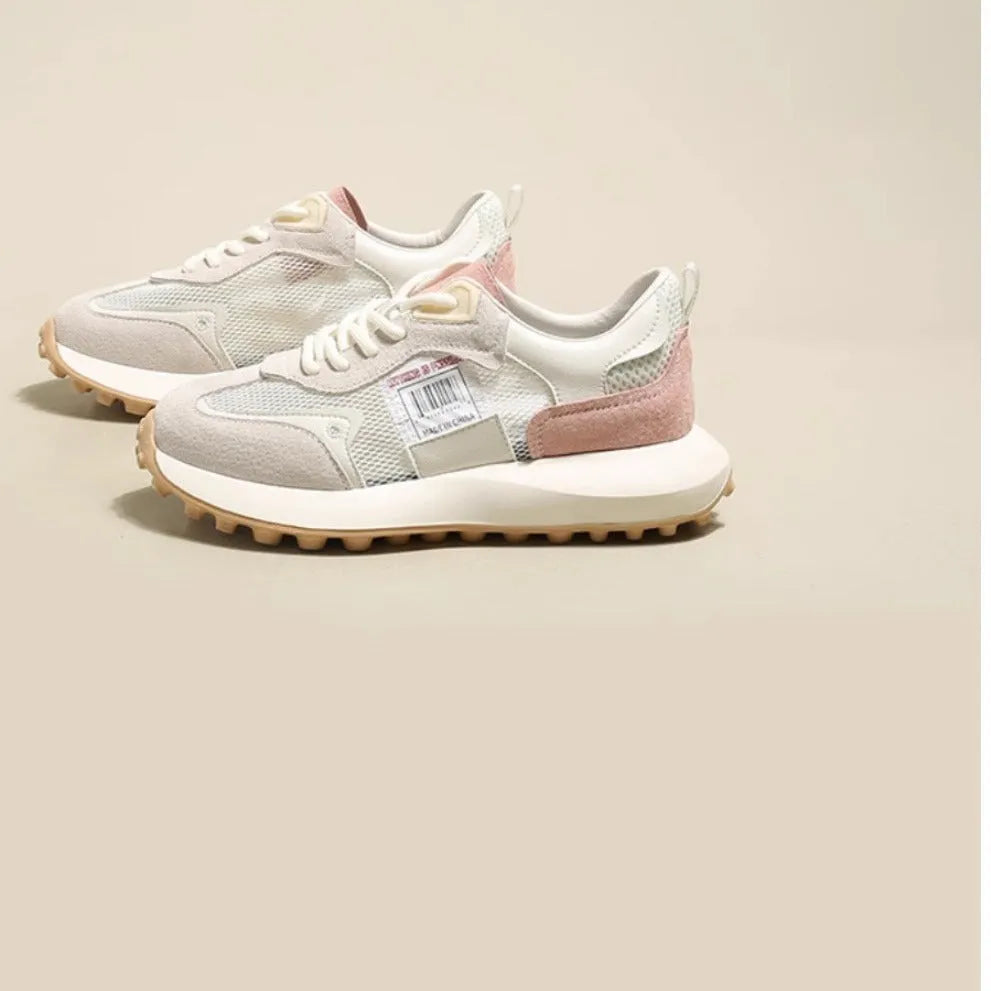 Women's gray and pink retro sneakers with mesh lining, rubber sole, and low-top design