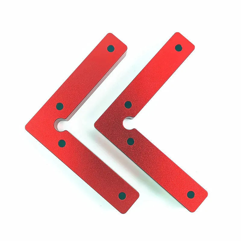Aluminium woodworking right angle positioning block with scale, shown next to a jigsaw.