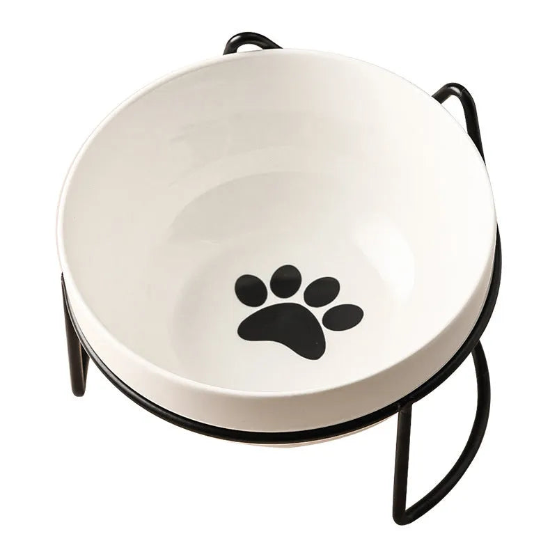 White ceramic cat bowl with decorative pattern and black iron frame support