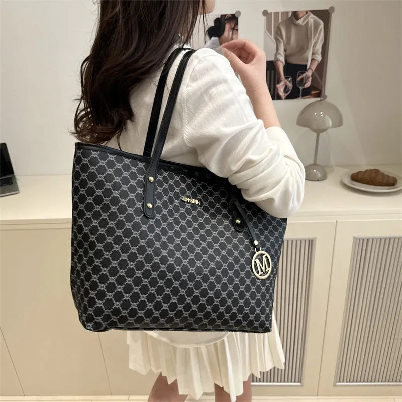 Women's structured PU leather shoulder bag with street trend sewing details shown in neutral colour options