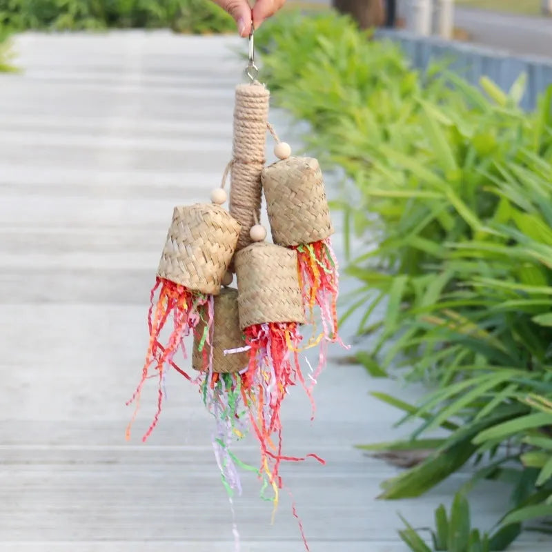 Colourful shredded paper parrot toy with wood and sisal construction measuring 35cm long