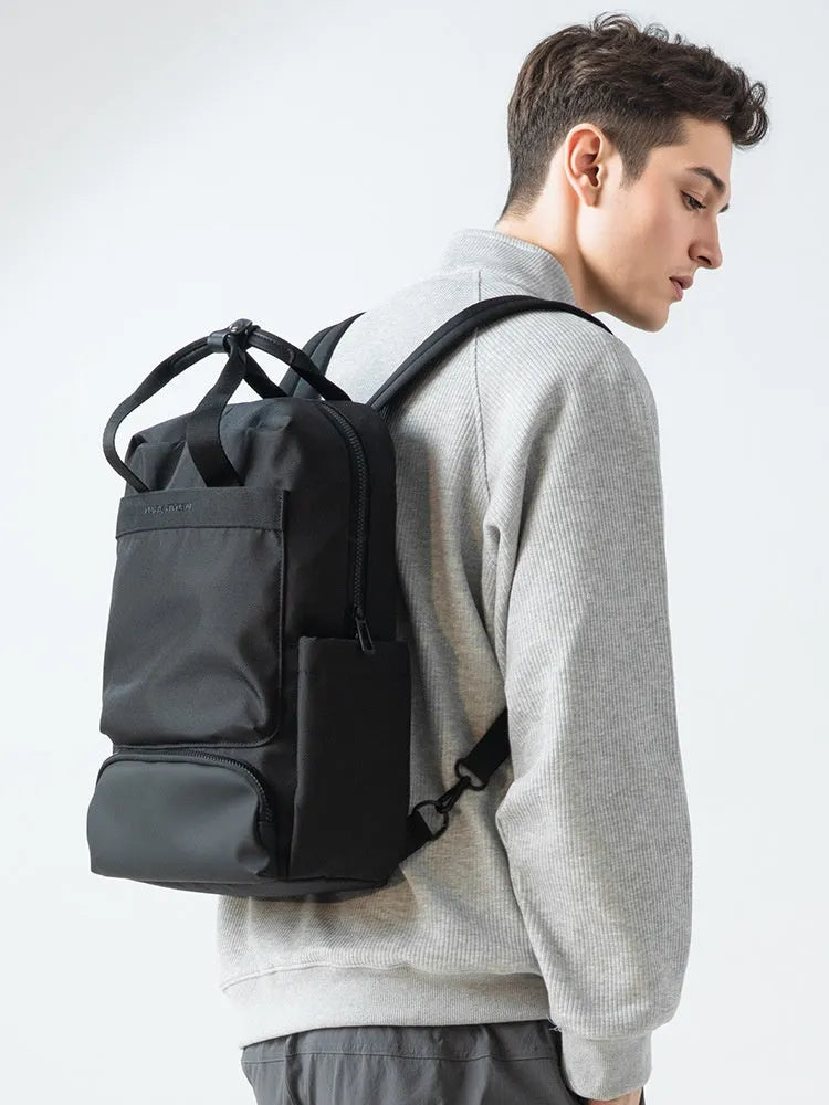 Elegant black Oxford cloth computer backpack with 20-35 litre capacity and polyester lining.