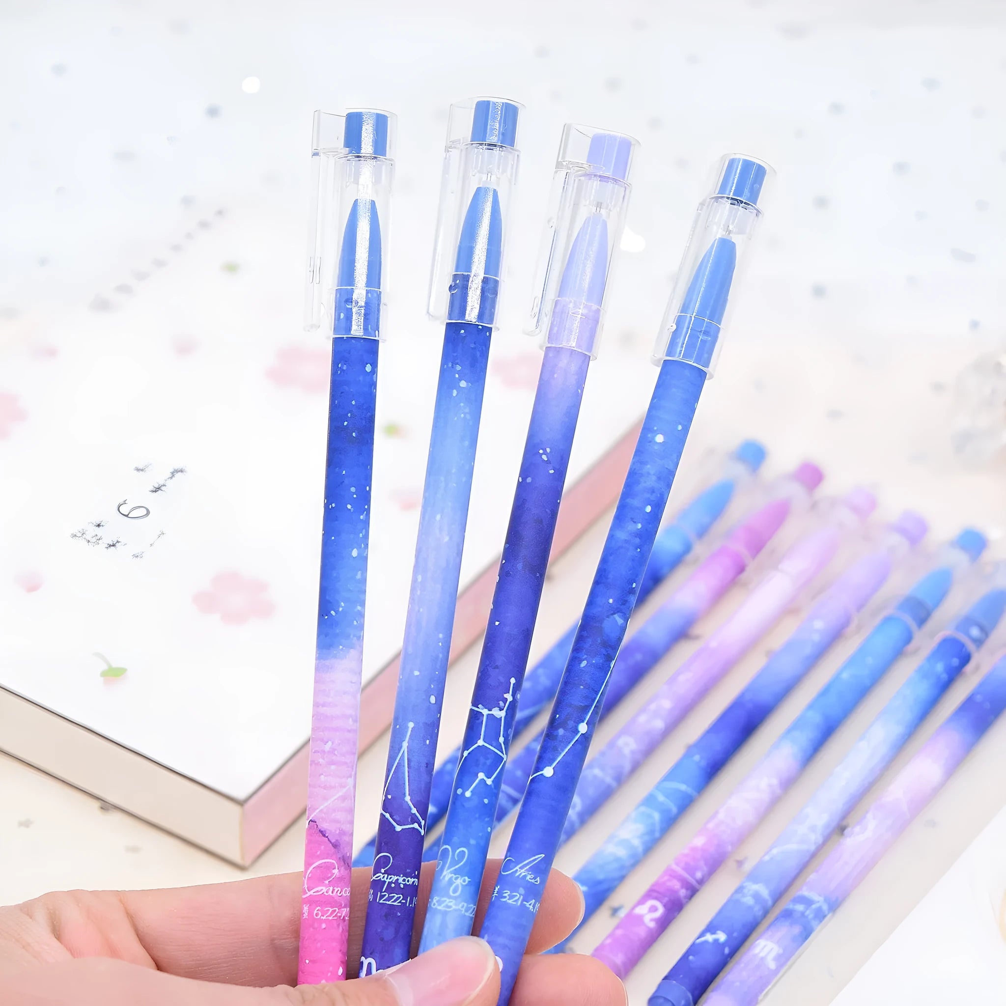 12 quick-drying gel pens with constellation designs in a plastic box