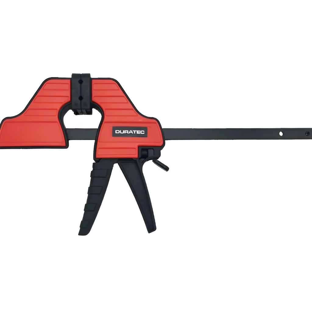 Black plastic woodworking clamp with quick-adjust key and soft rubber protective grip.