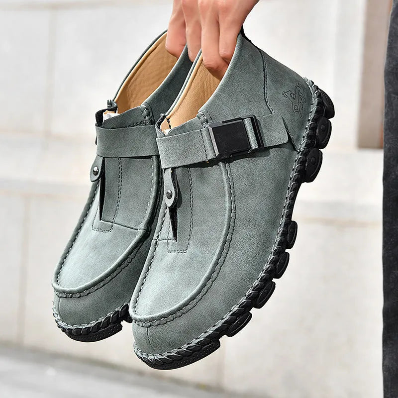 Handmade brown PU leather slip-on casual shoes with flat heel on a white background.