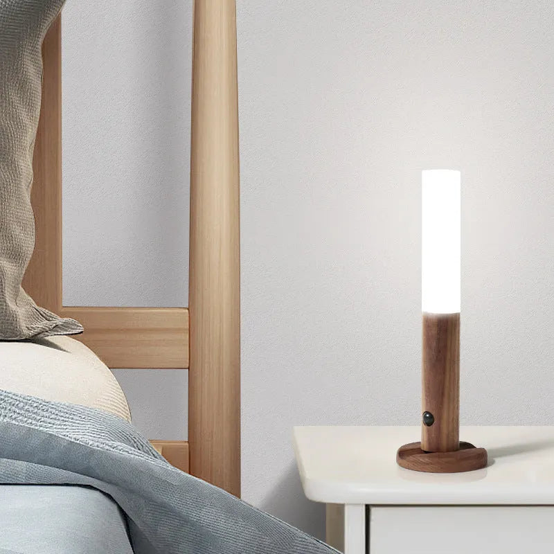 Smart sensor LED desk lamp with solid wood base showing compact design and warm white illumination