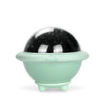 Green UFO-shaped starry sky projection night light with LED lighting on table