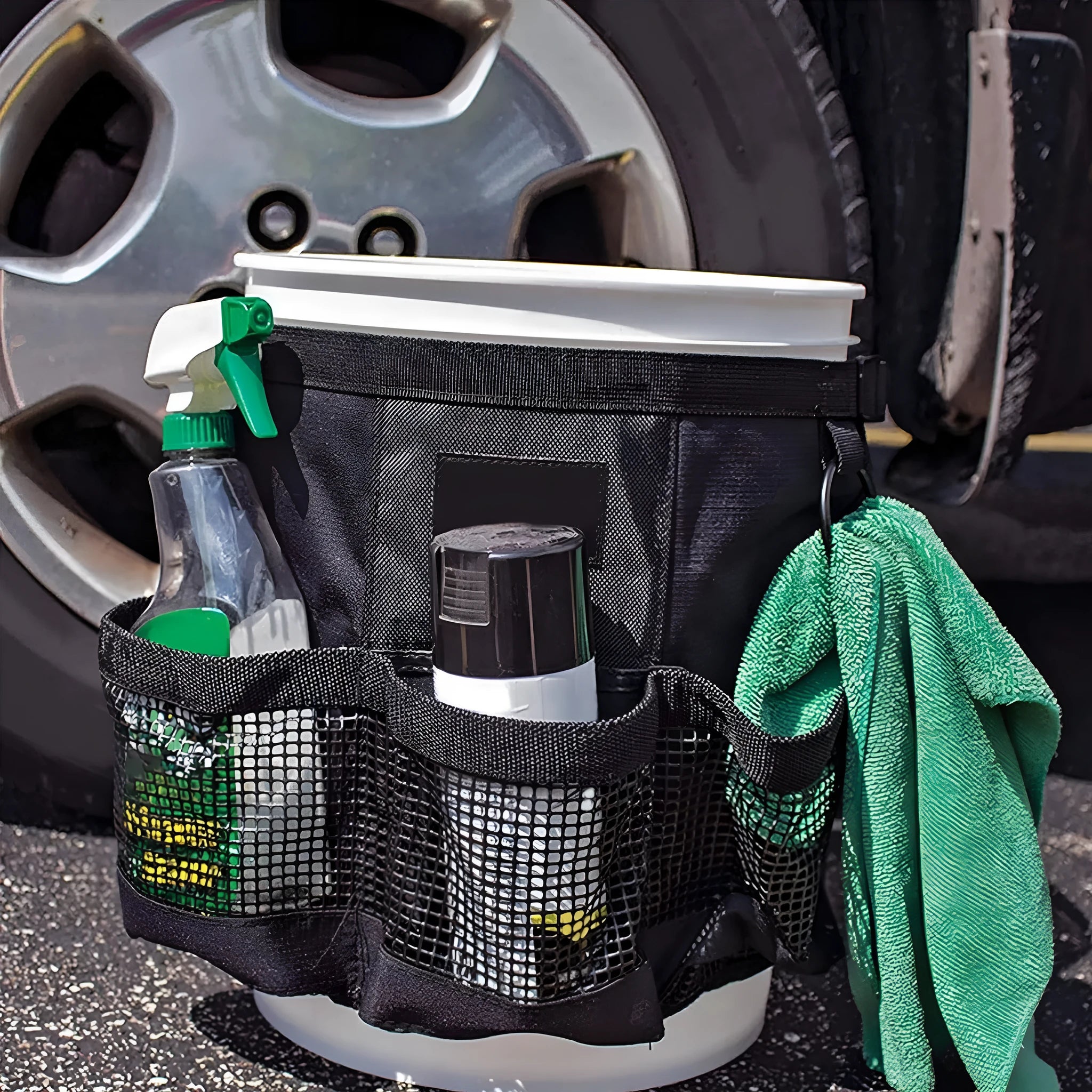 Black polyester hanging storage bag designed for a 5-gallon barrel, showing cylindrical shape.