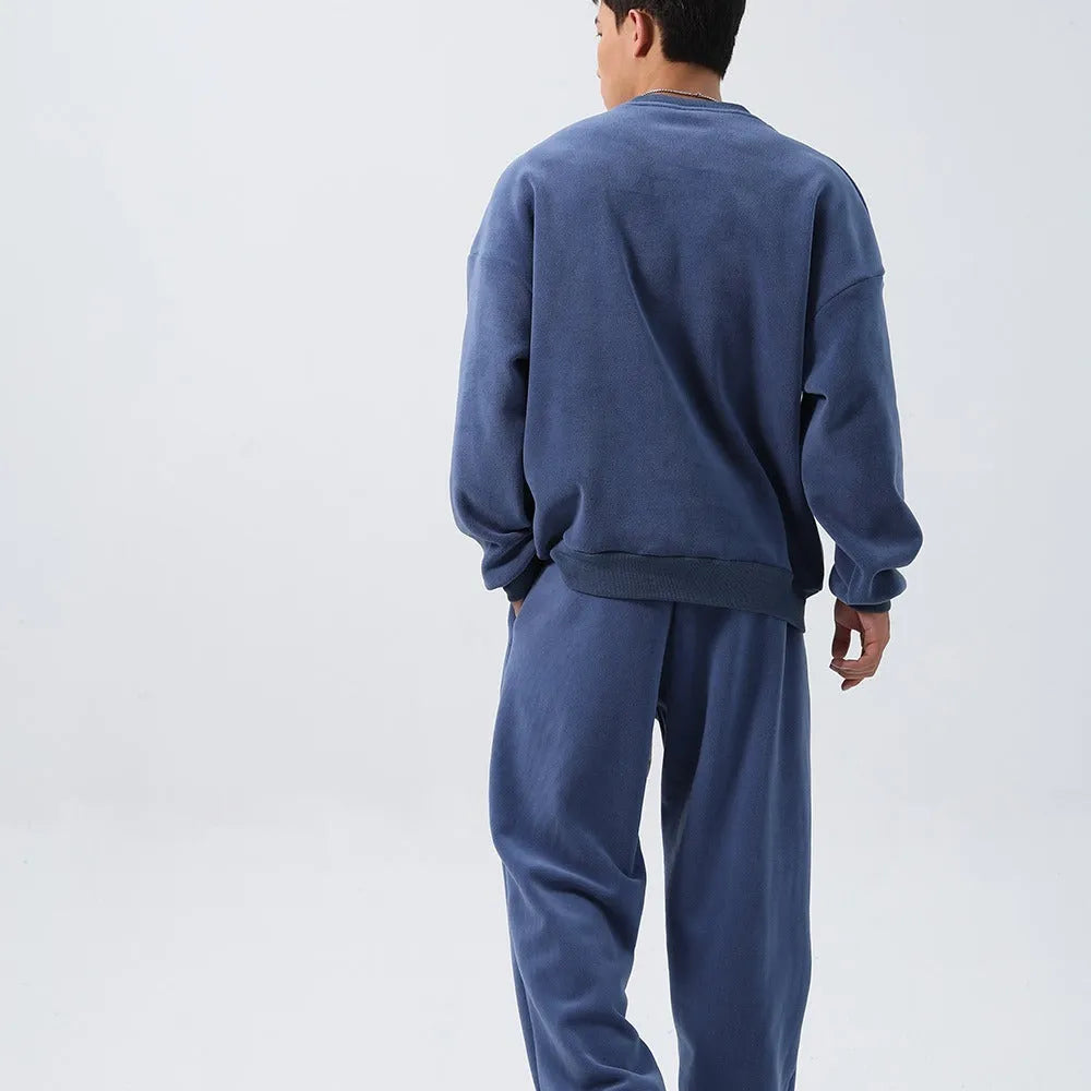 Men's black polar fleece tracksuit with crew neck jacket and matching padded trousers