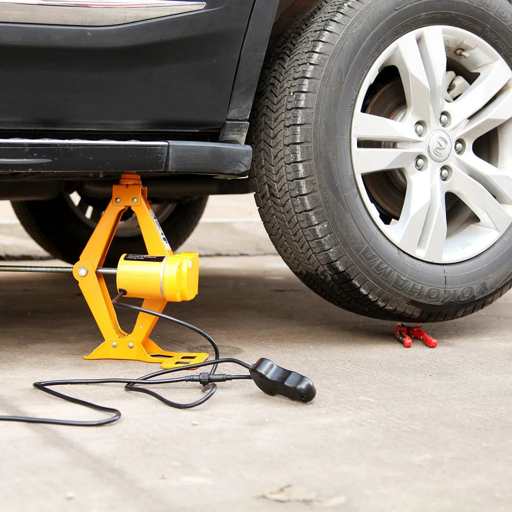 TY002 electric vehicle jack kit with 2 tonne capacity shown next to car tyre