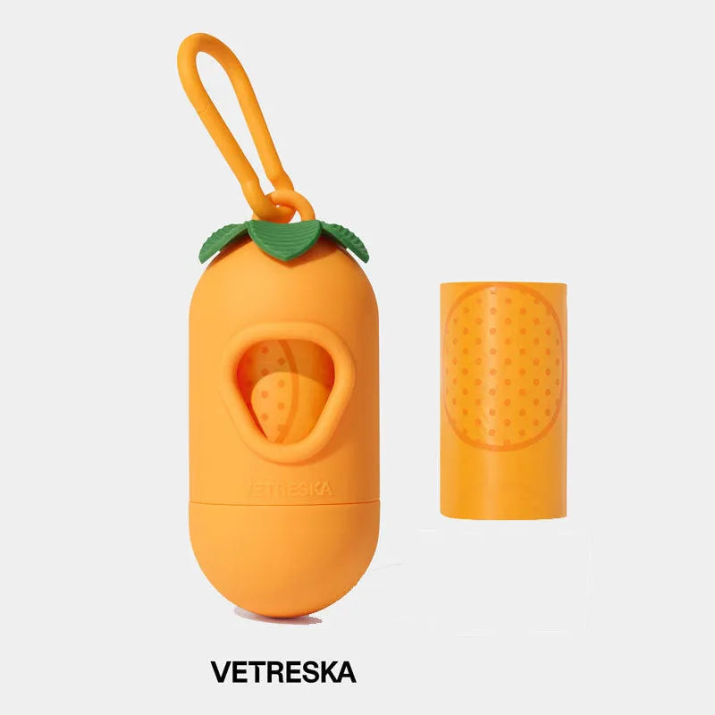 Portable plastic capsule dispenser for scented dog poo bags in strawberry, orange, and cherry blossom designs.