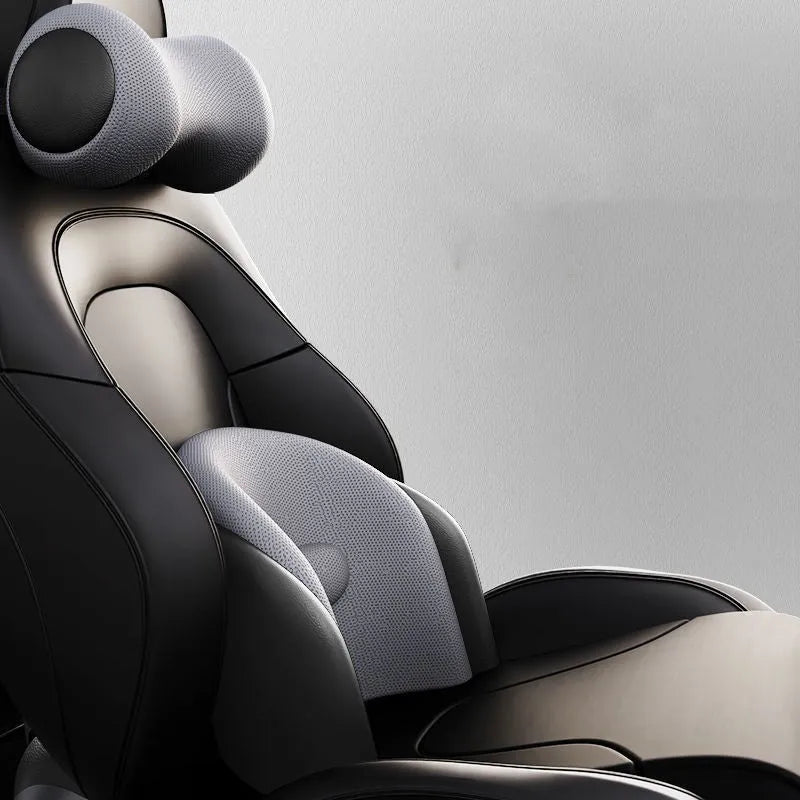 Classic black memory cotton car massage cushion shown as a headrest and lumbar support on a car seat.