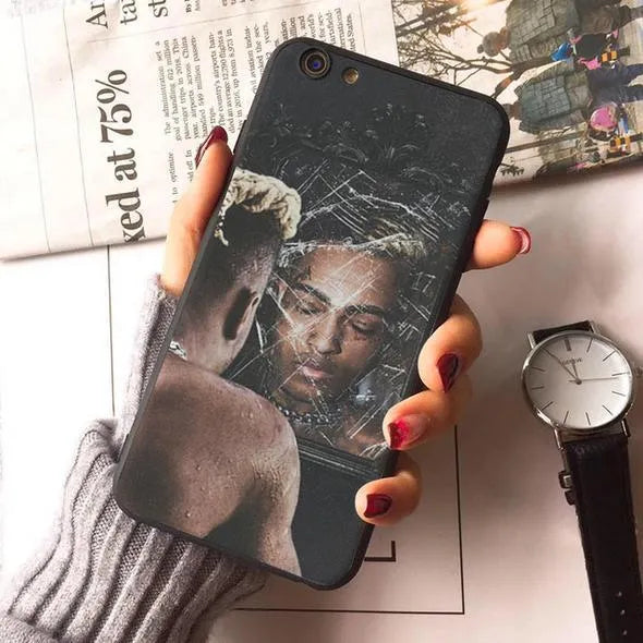 Transparent matte iPhone case with printed XXxtentacion design, shown fitted on a smartphone.