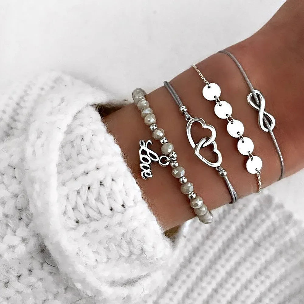 Bohemian bracelet set with alloy vintage bead and boho charm design in bow love style for women