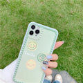 Green iPhone case with smiley face geometric patterns and polka dot frame designs