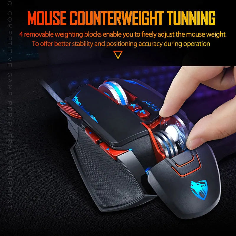 Thunder Wolf V9 black and grey wired gaming mouse with ergonomic shape and six buttons on a desk.