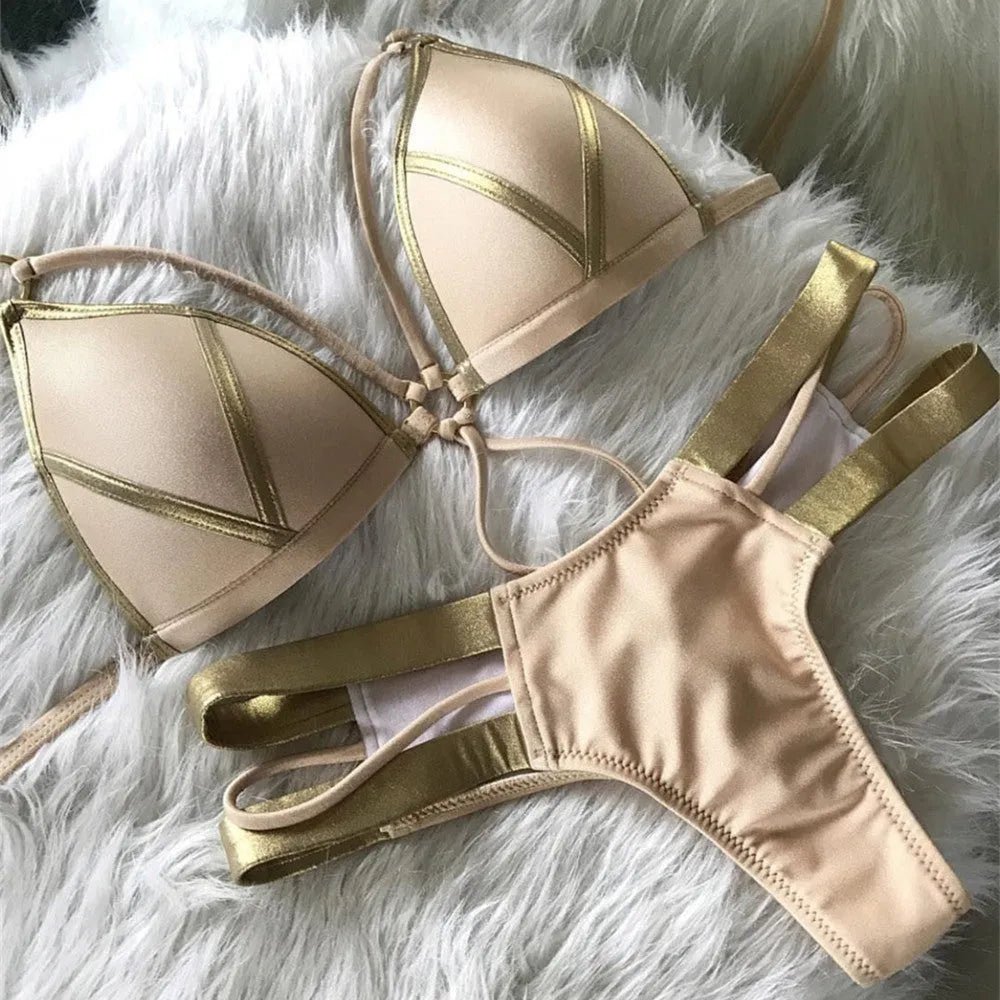 Women's bronzing bikini swimsuit with padded cups, shown in multiple colour and print options including leopard and snakeskin.