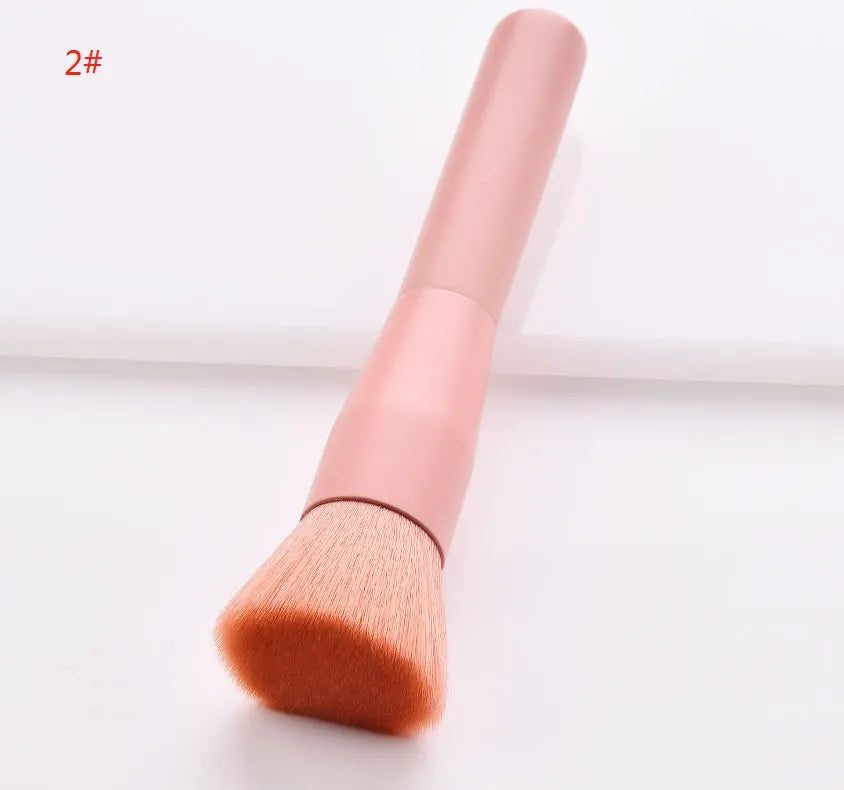 Open case showing 10 pink-handled makeup brushes including loose powder, foundation, flat head, and double-ended brushes.