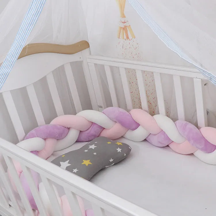 Baby crib bumper braid knot pillow cushion in spandex velvet, shown in a light grey colour