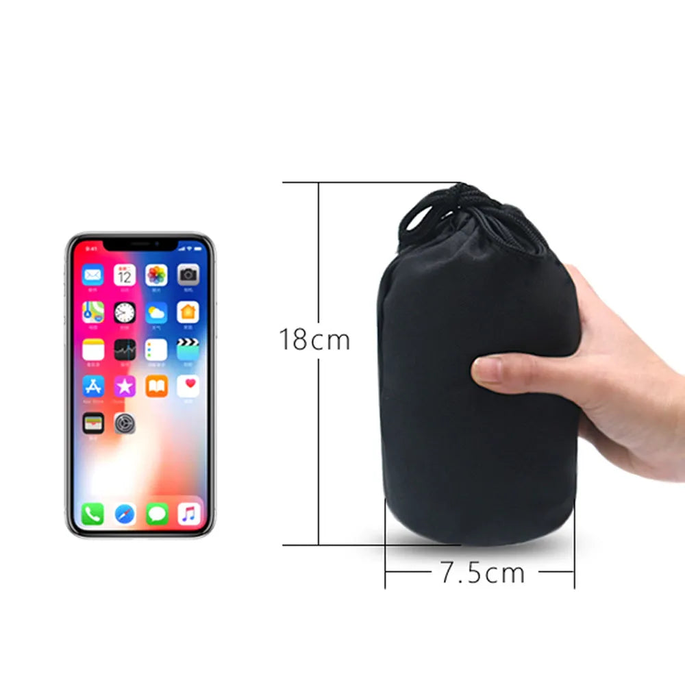 Grey inflatable travel pillow with flocking surface, M size 26cm x 31cm x 51cm, shown inflated with storage bag