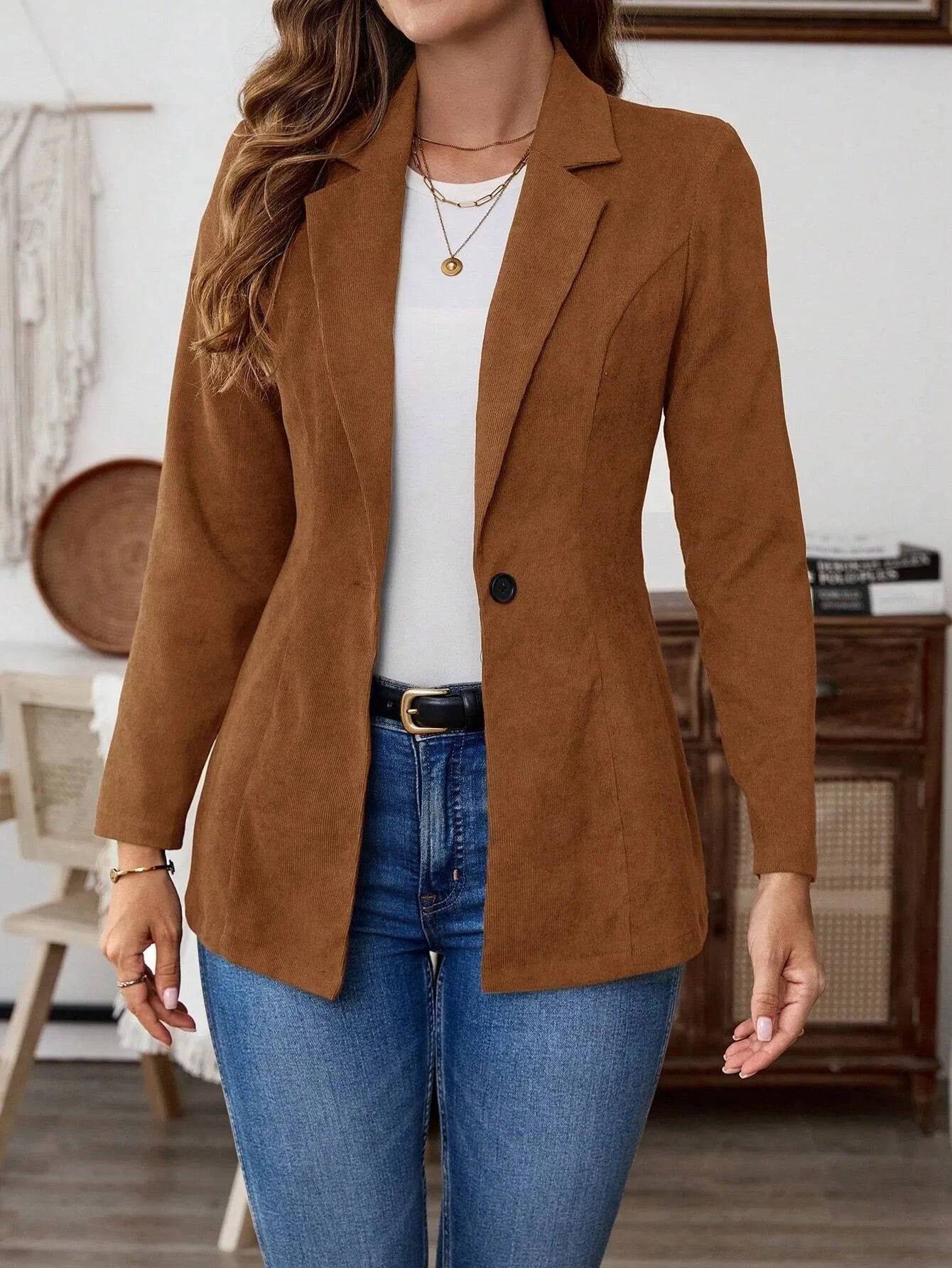 Brown lapel long sleeve single-breasted suit coat on a hanger