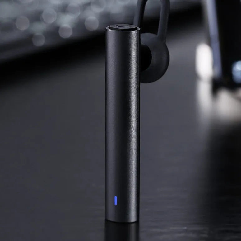 Compact wireless Bluetooth headset in Black, 5.6 cm long, with earpiece and charging port visible