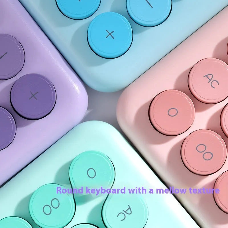 Gradient colour desktop calculator in four colour options on desk