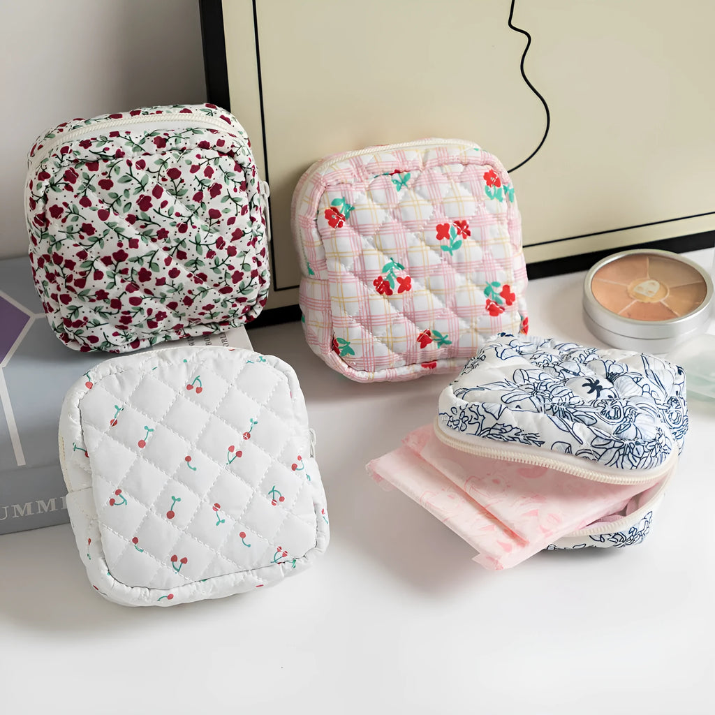 Cute Change women's polyester key storage bag in a floral pattern with sewing thread detail.