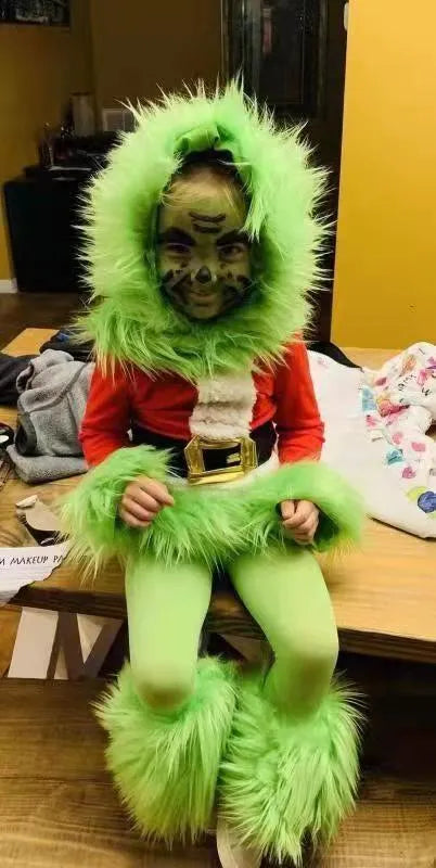 Children's green cotton Halloween costume set with top and pants on display
