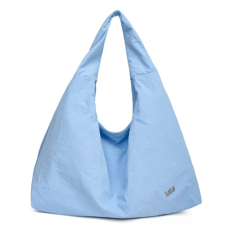 Women's heart-shaped nylon underarm bag in black, yellow, khaki, and blue colour options showing large capacity design