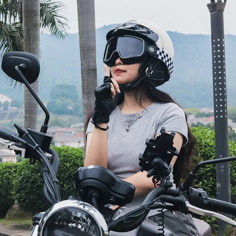 Retro style motorcycle helmet shown in cement grey colour on a plain background.