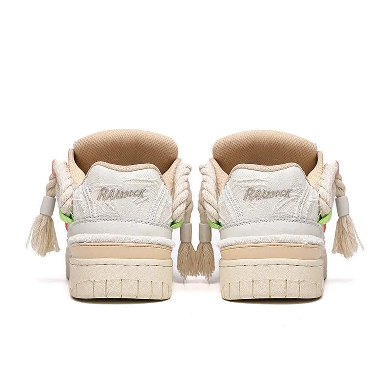 Creamy white Old Damage retro skate shoes with lace-up front, low-top platform heel, and rubber sole.