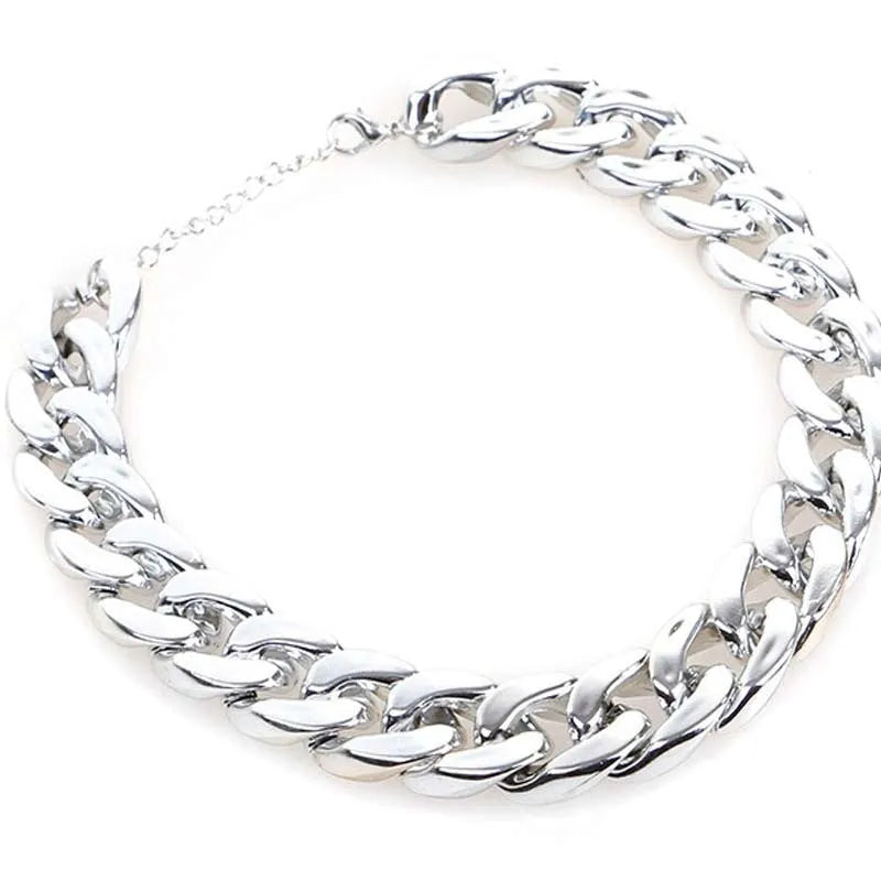 Geometric twisted chain dog collar with buckle on a white background, shown in a gold colour.
