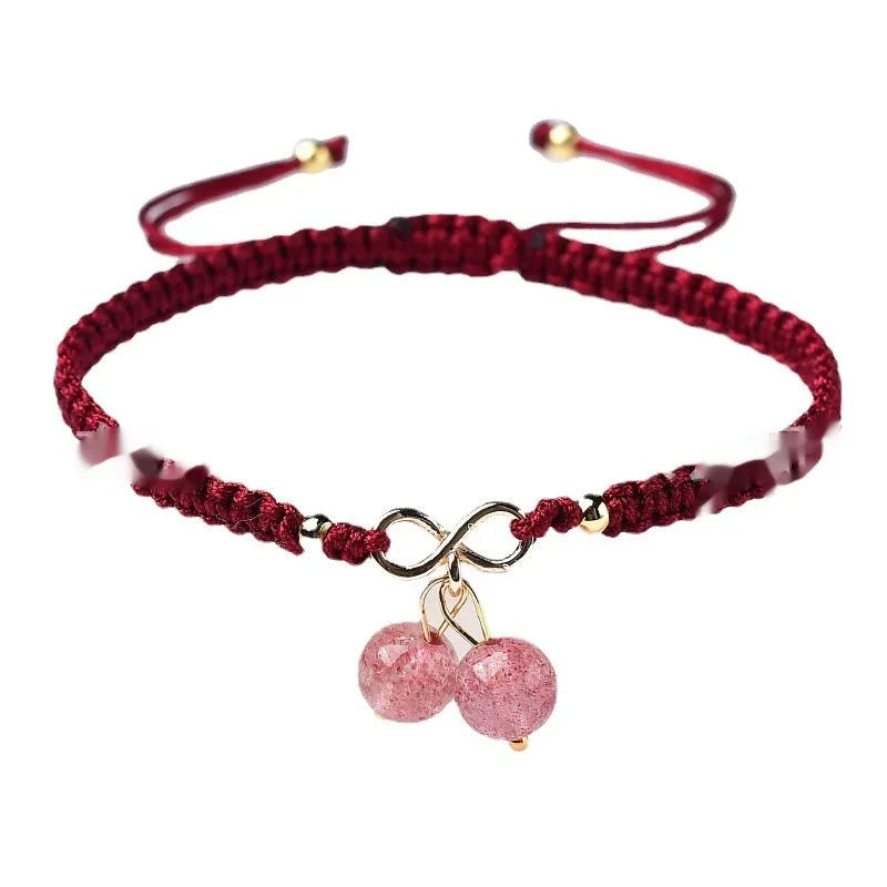 Women's natural strawberry quartz bracelet with detailed cherry charm and crystal beads.