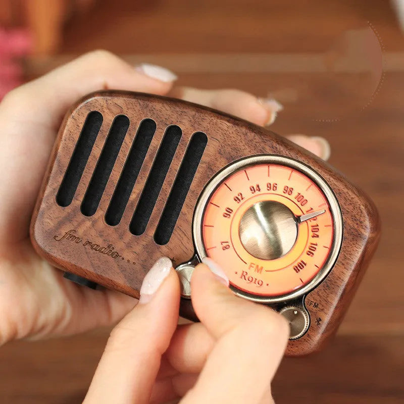 Retro style wooden mini wireless Bluetooth speaker in cherry wood or walnut finish.