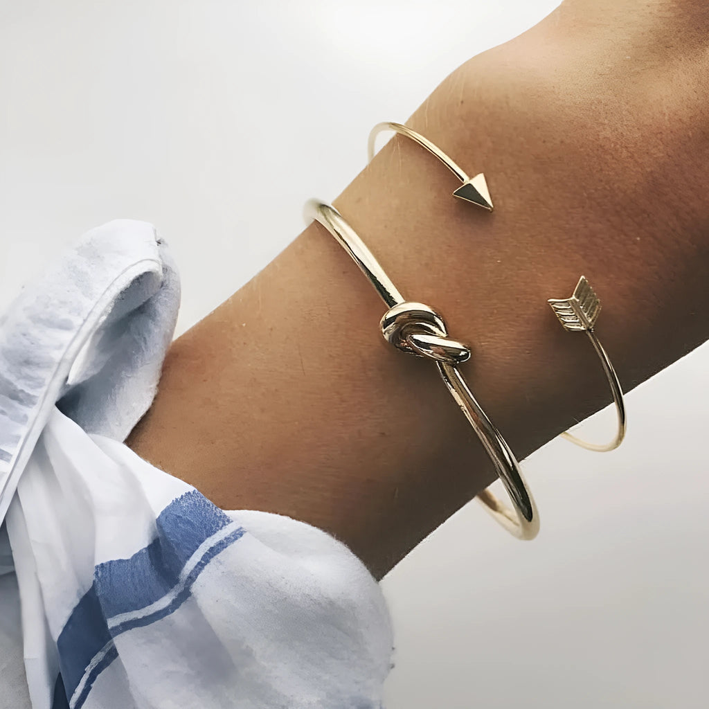 Women's gold vintage cuff bracelet with knotted arrow design in alloy with electroplated finish