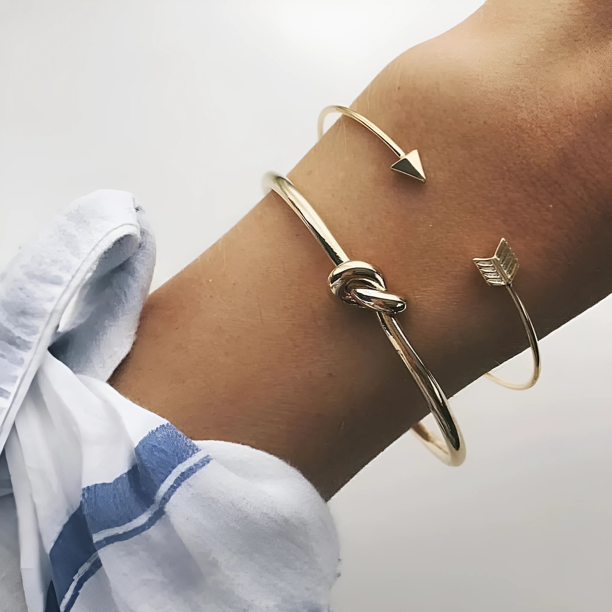 Women's gold vintage cuff bracelet with knotted arrow design in alloy with electroplated finish