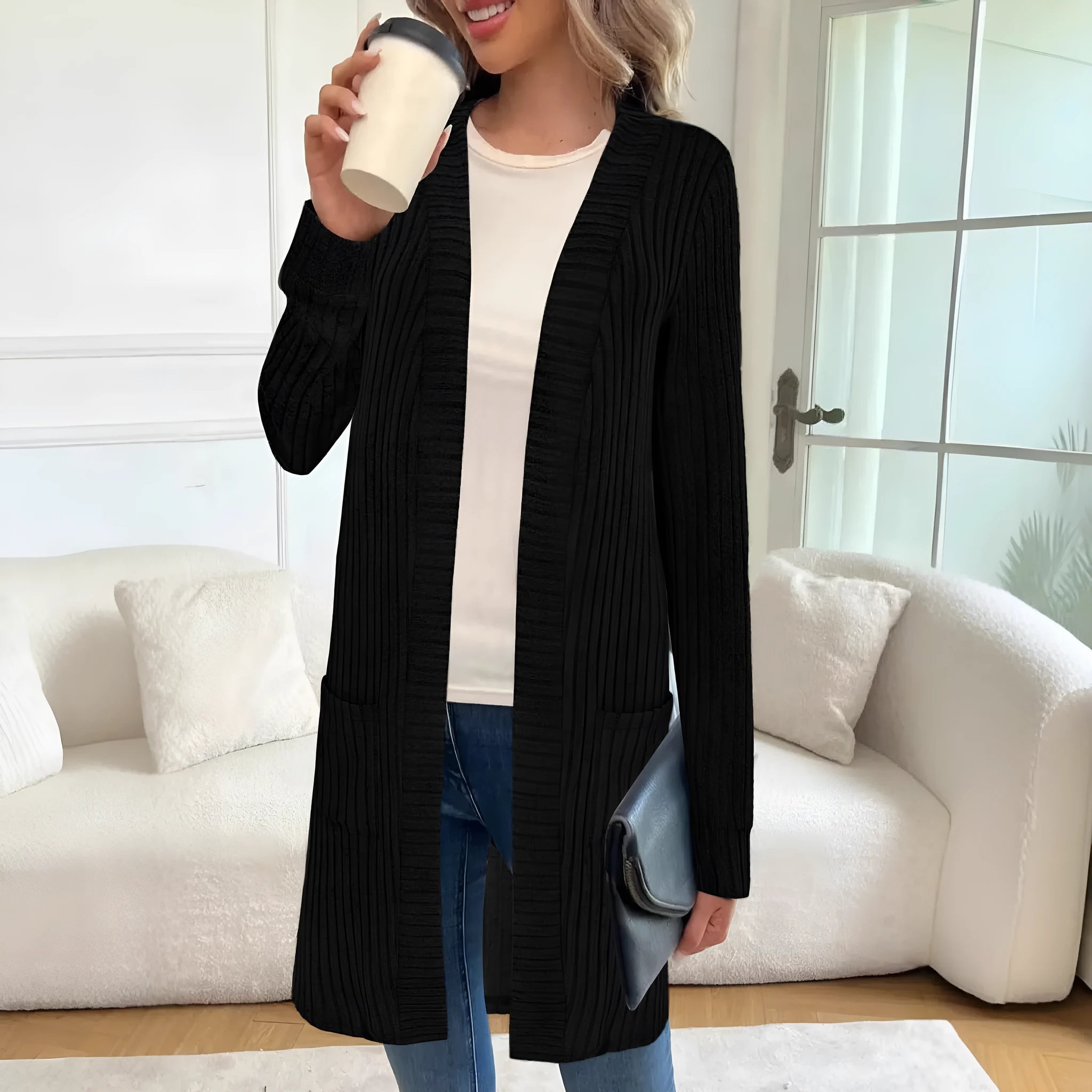 Loose long sleeve knitted cardigan jacket in black with side pockets.