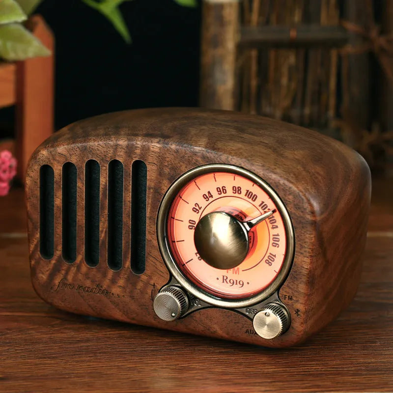 Retro style wooden mini wireless Bluetooth speaker in cherry wood or walnut finish.